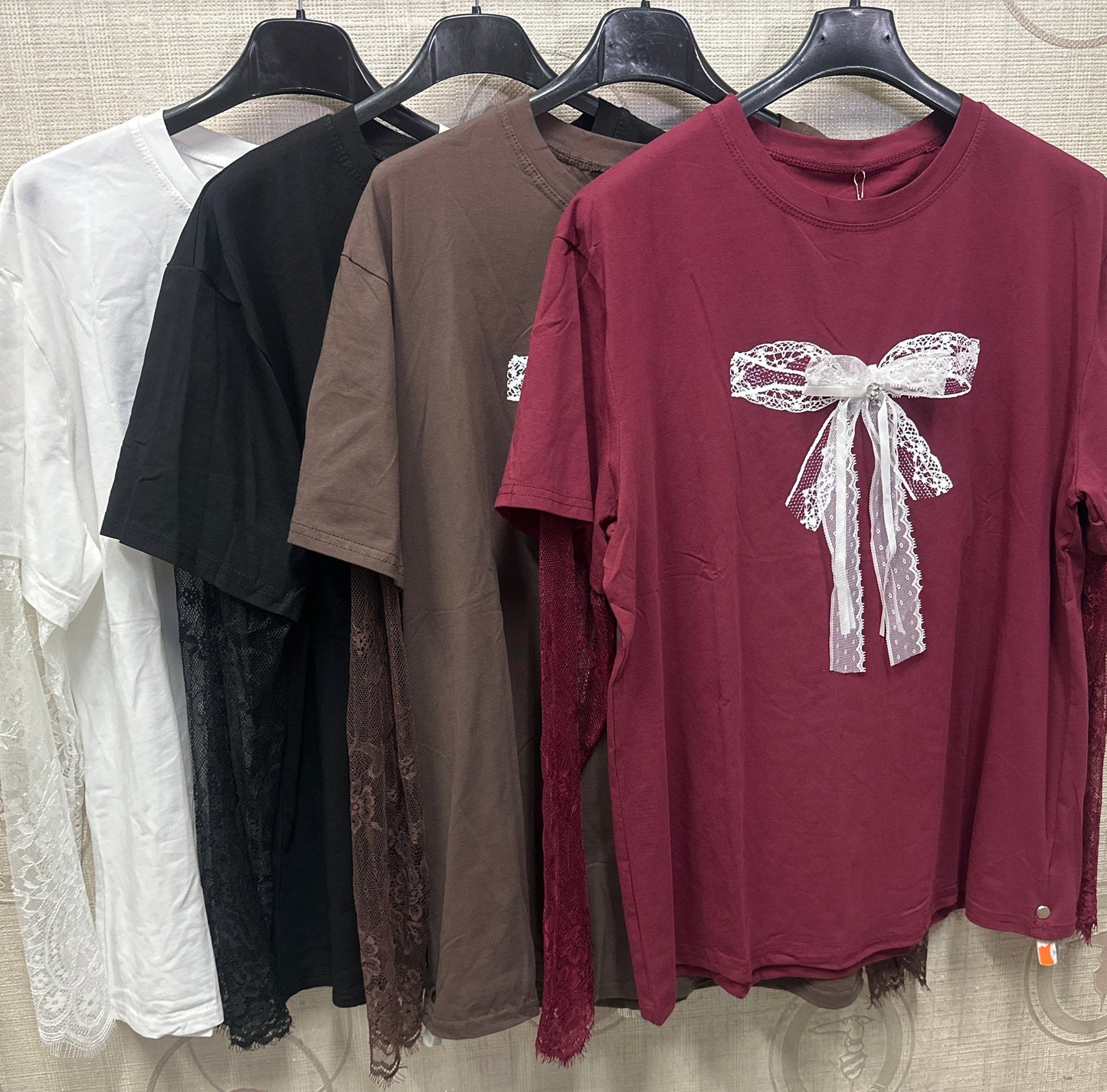 Maglia fiocco con manica velata