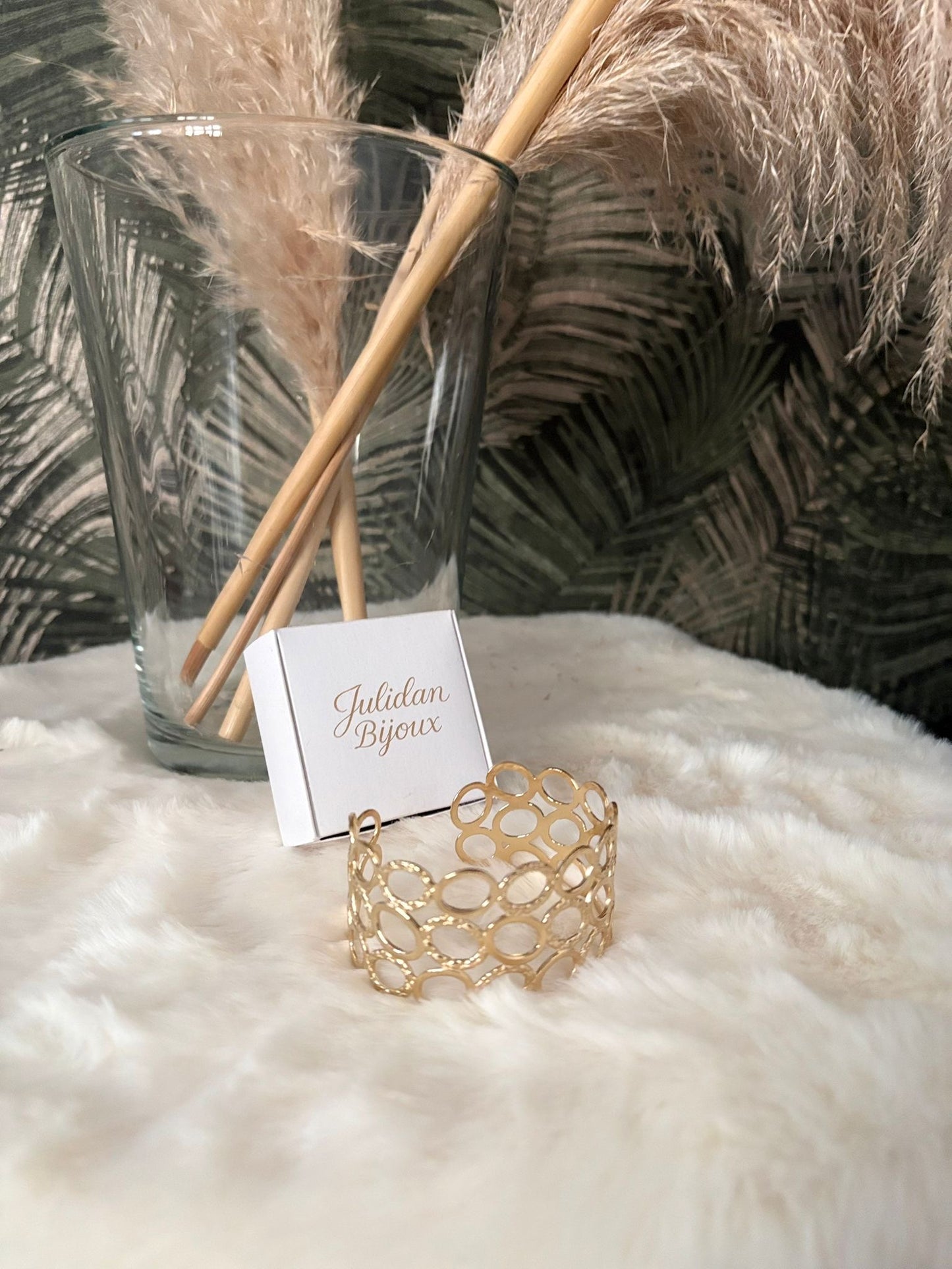 Bracciale fascia larga con design a maglie ovali interconnesse