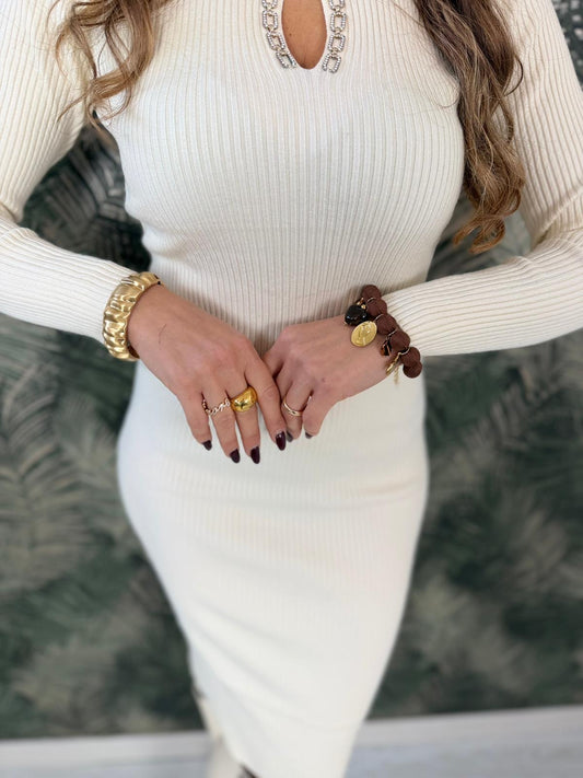 Bracciale rigido in metallo dorato con superficie testurizzata a coste