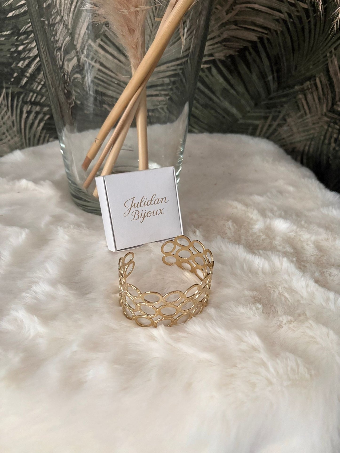 Bracciale fascia larga con design a maglie ovali interconnesse