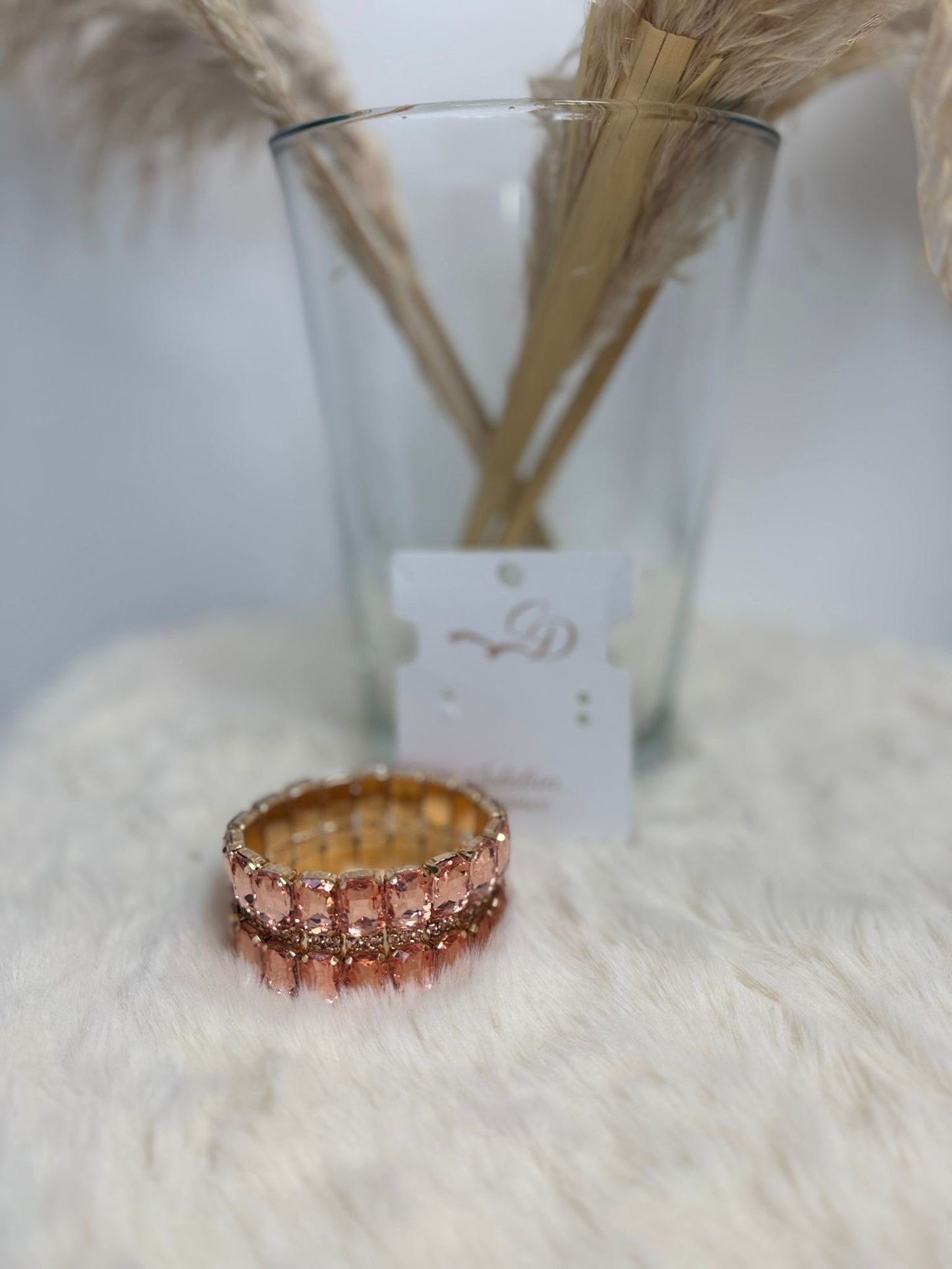 Bracciale elastico con pietre incastonate rosa